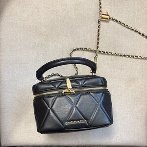 Charles & Keith Black Quilted Top Handle Camera Bag with Gold Chain